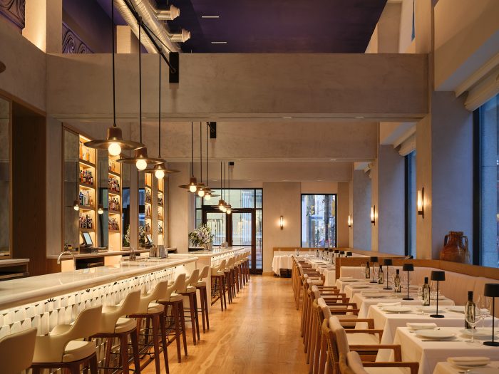 Lounge private event space at Milos Toronto showing private bar and banquette seating for