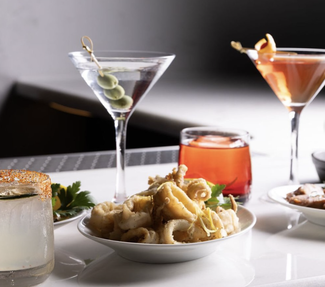 Meze Hour at Milos Toronto with cocktails and small bites on an inviting table