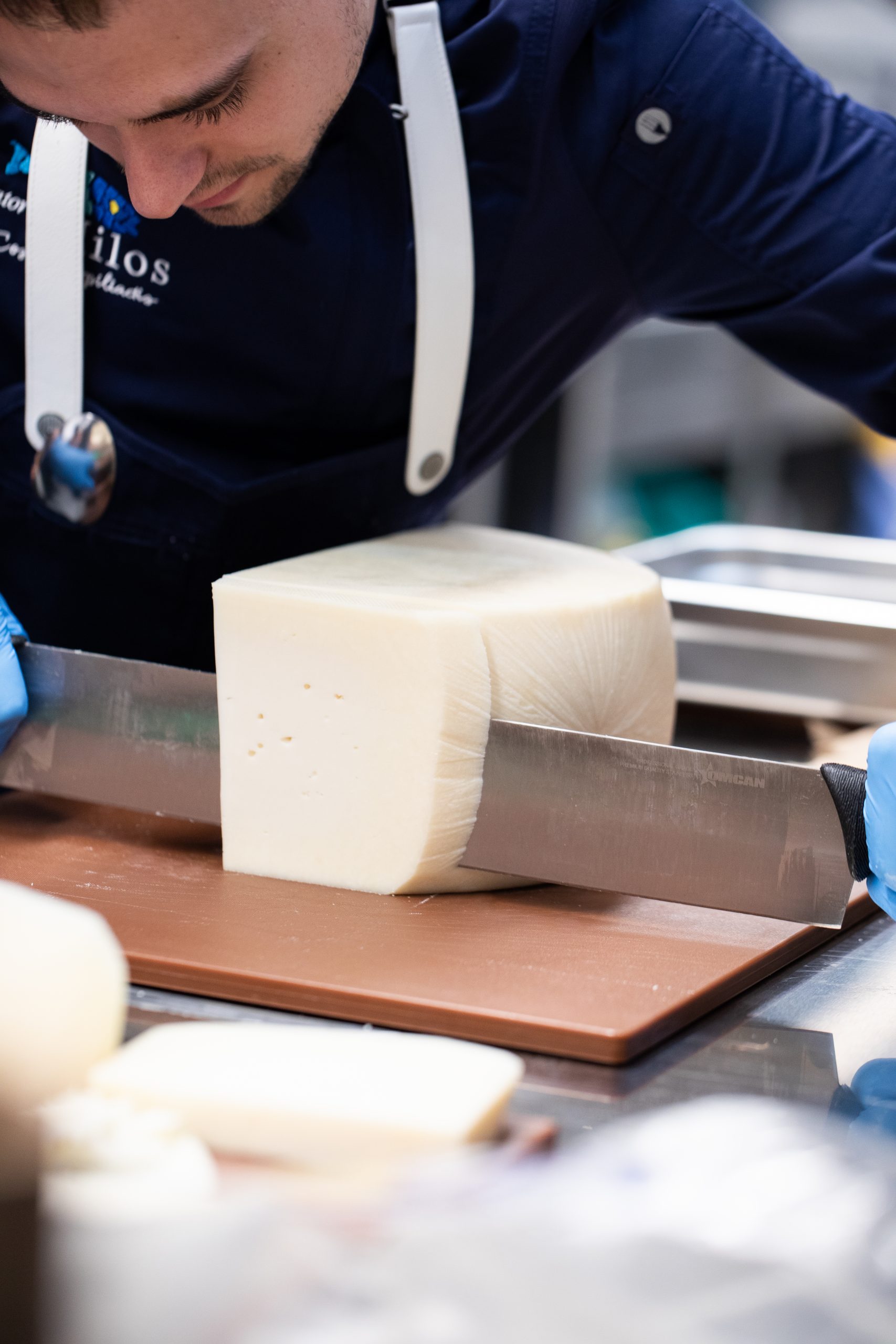 chef slicing cheese